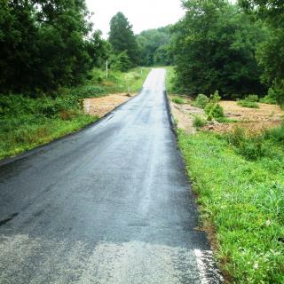 Route EE in Douglas County with recently completed asphalt and shoulder repairs.